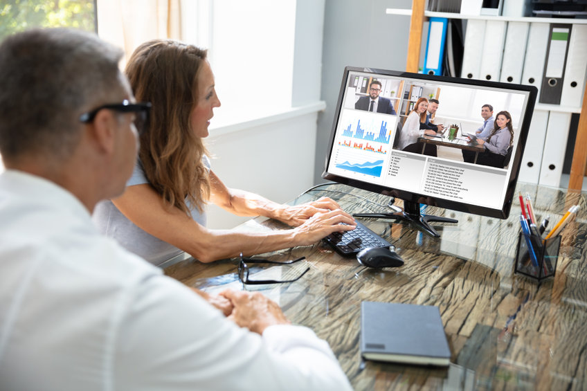 Businessman Video Conferencing With His Colleague