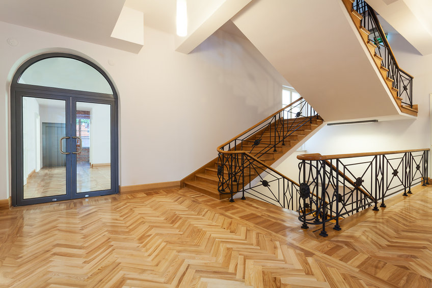 Classical interior, wooden hall with a staircase