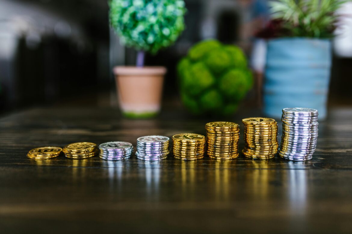 Gold and silver bitcoins on table