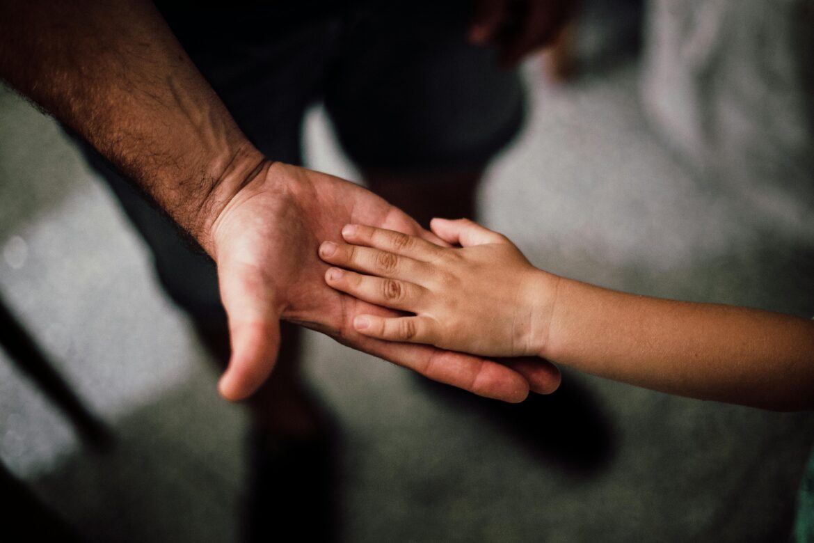 Father and child s hands together