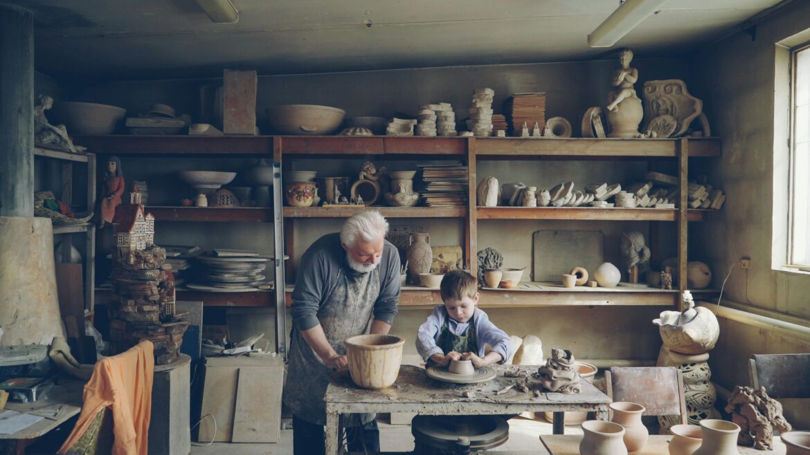 Grandfather and grandson in pottery workshop