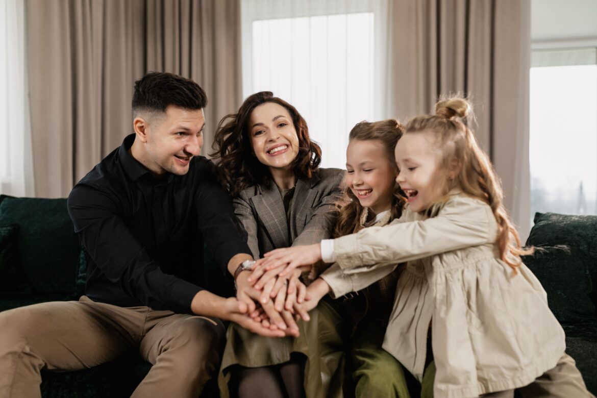 A happy family with their hands together
