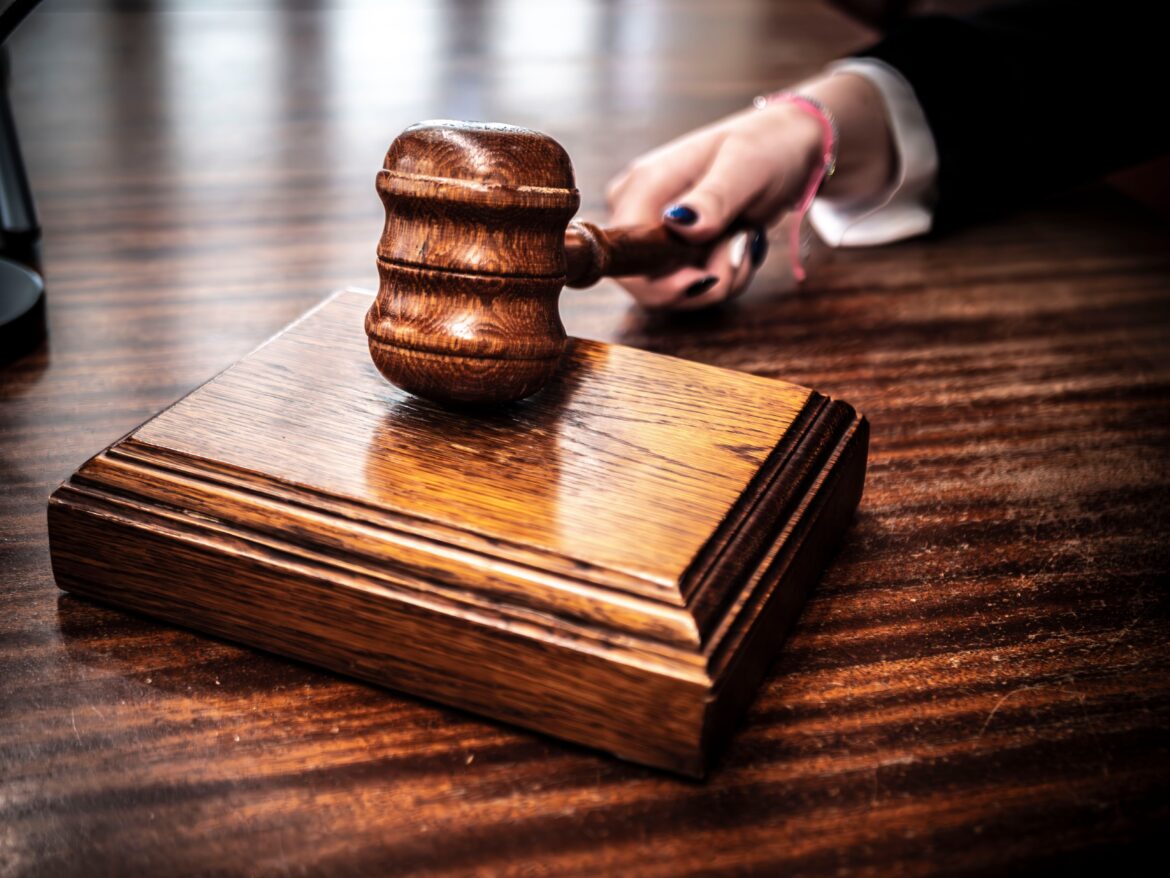 Judge s wooden gavel on desk close up