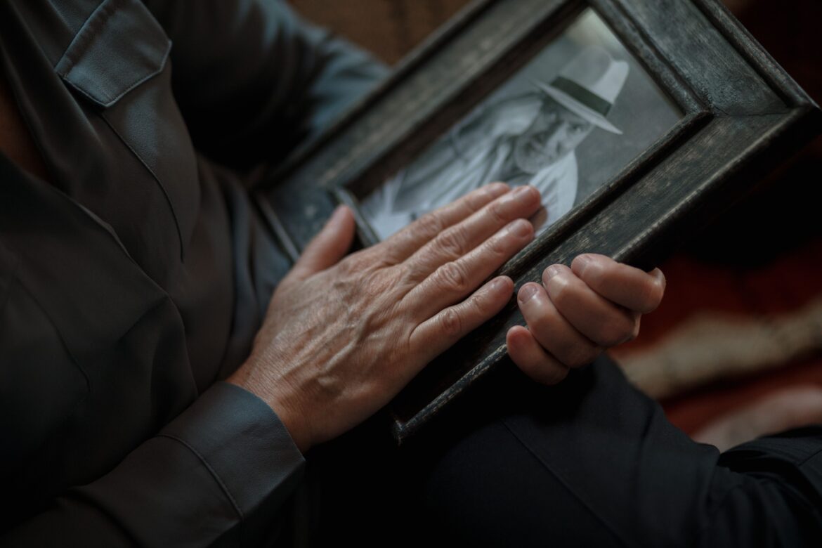 Close up shot of a person holding a picture frame