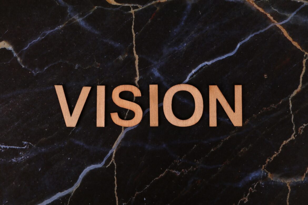 Vision text on dark marble background