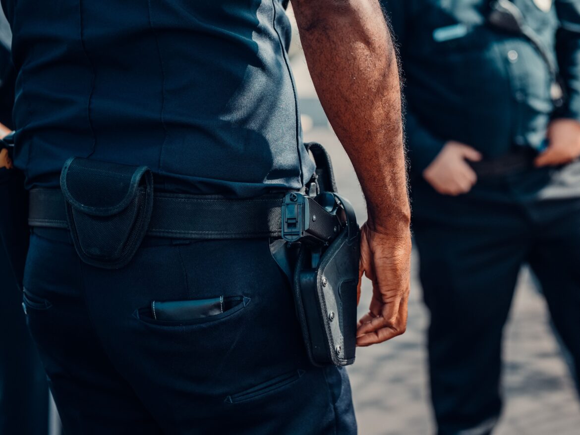 A person with gun on his waist
