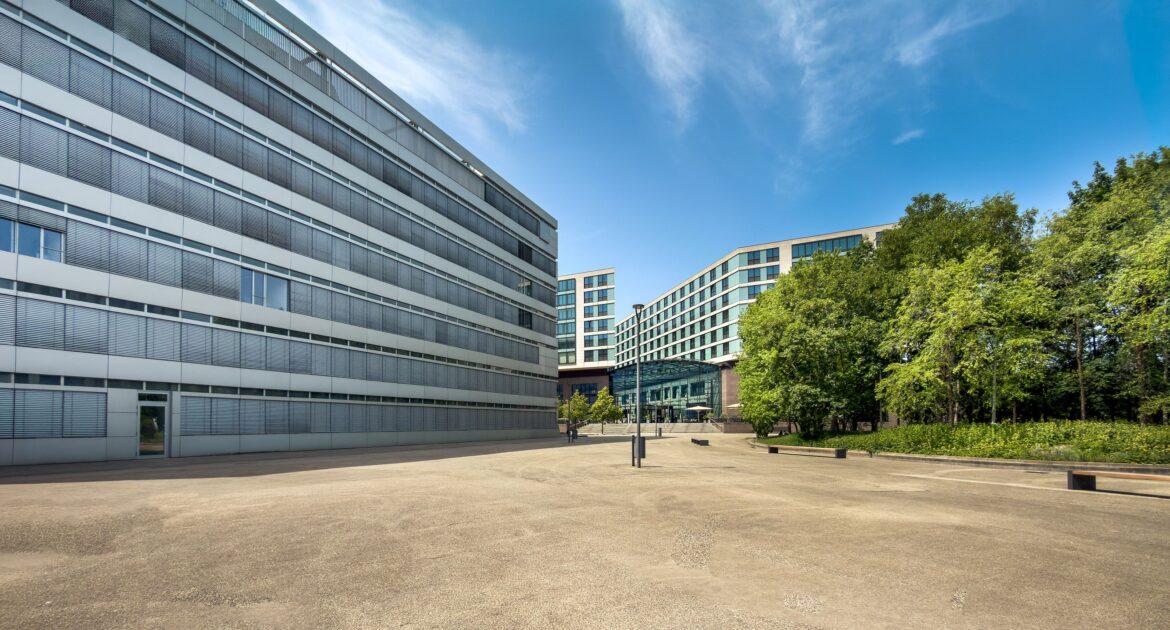 Modern office buildings with greenery on a sunny day