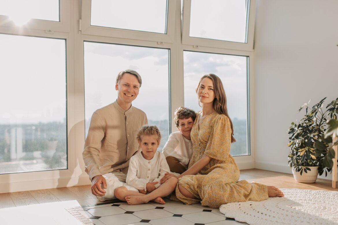 A family sitting on the floor