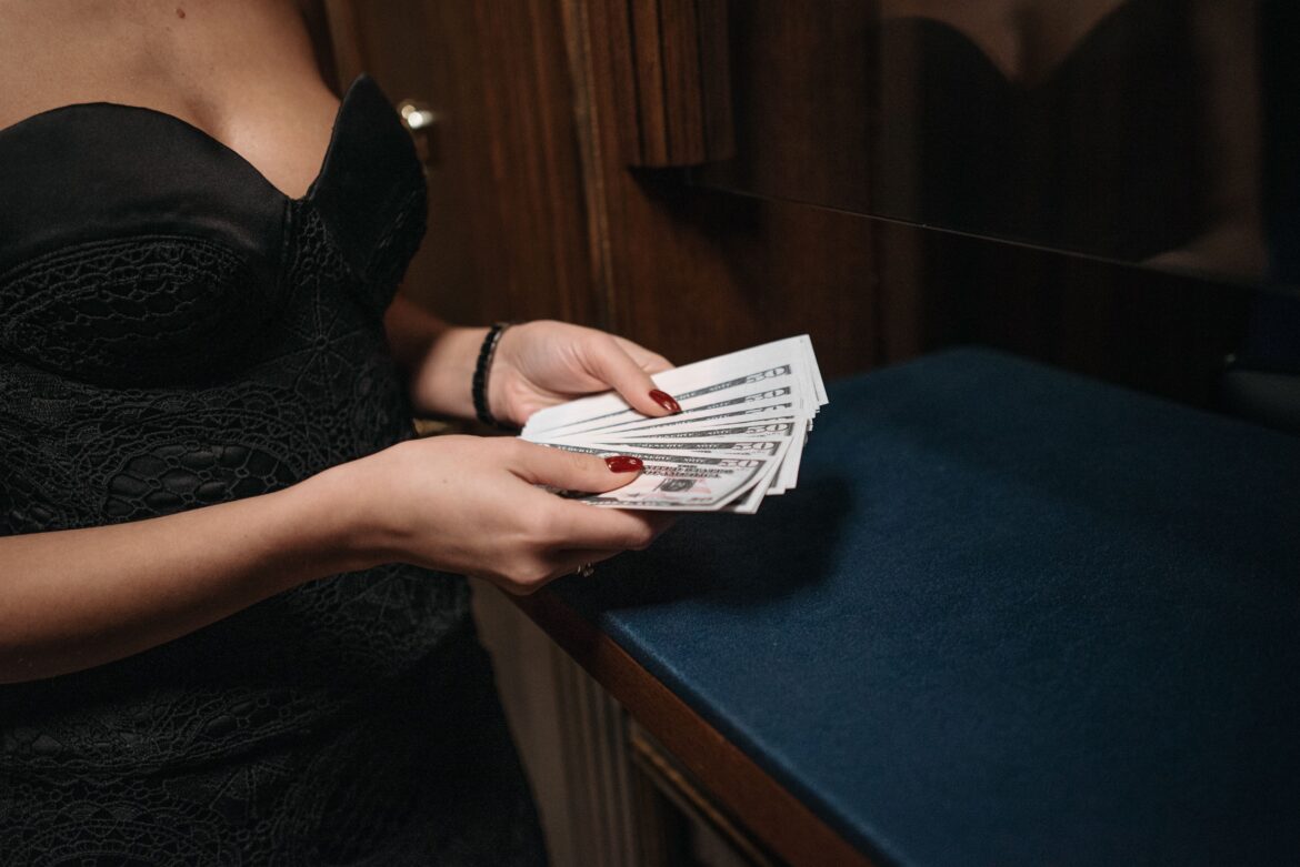 A person holding paper money