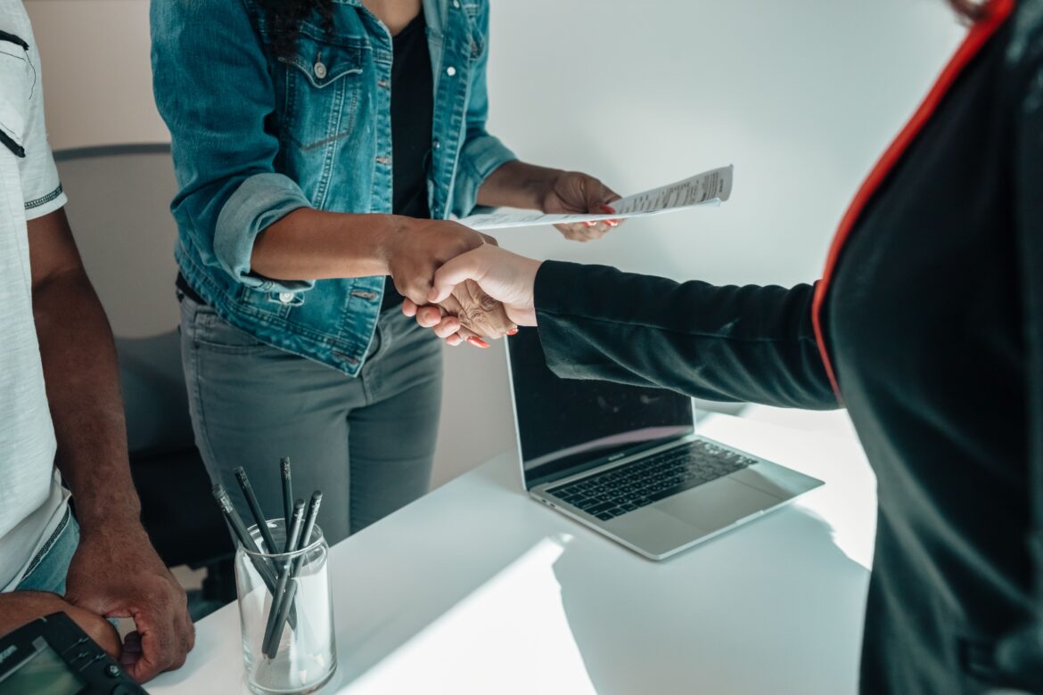 Caucasian and african american people handshaking