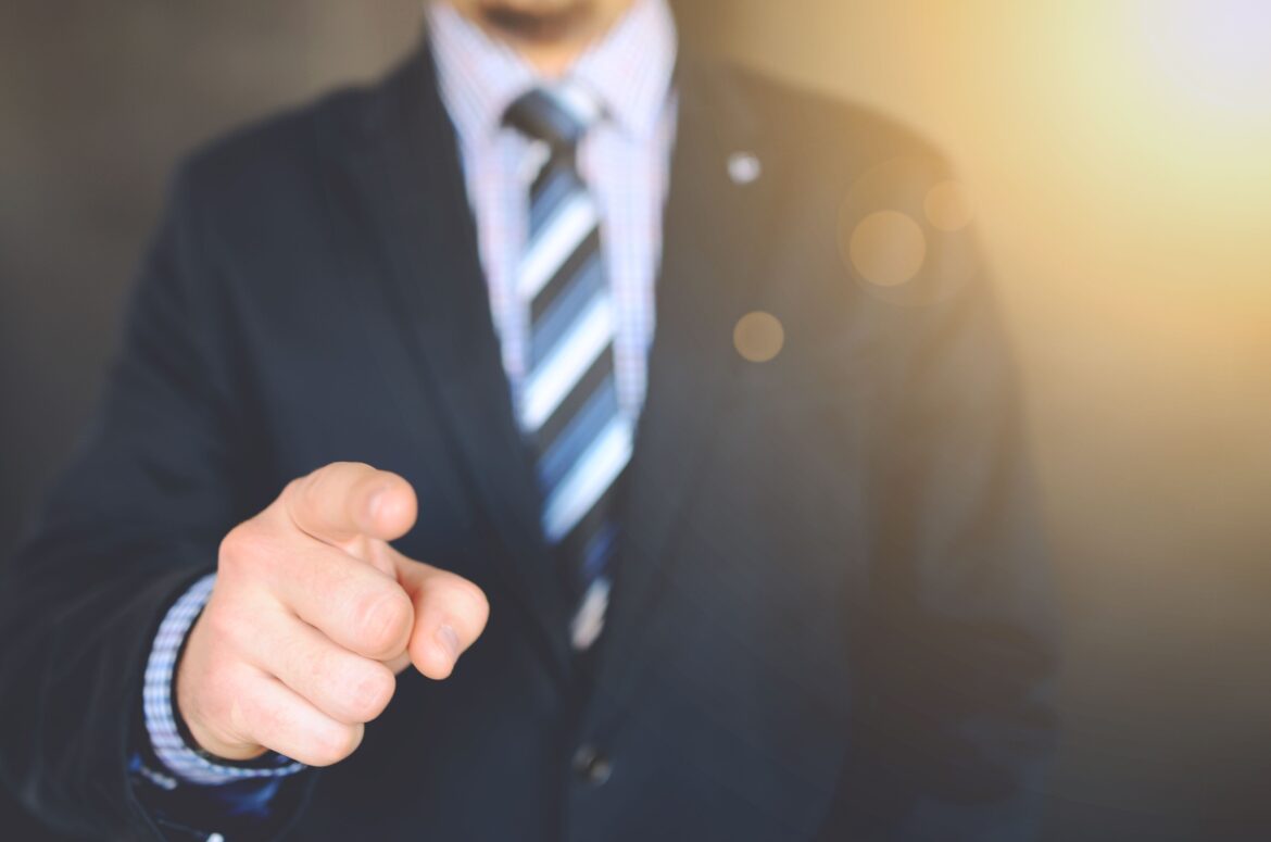 Close up photo of a person wearing suit jacket