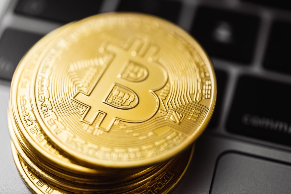 Close up shot of bitcoins on laptop computer