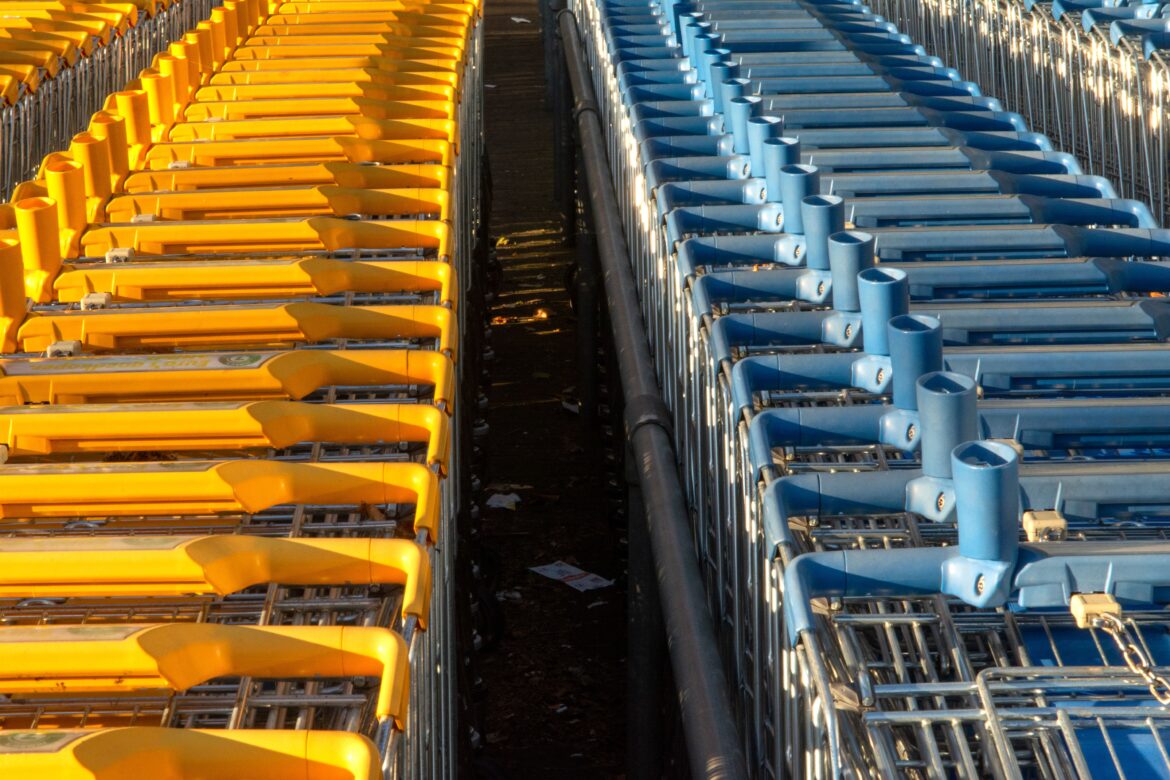 Colorful shopping carts in parallel rows
