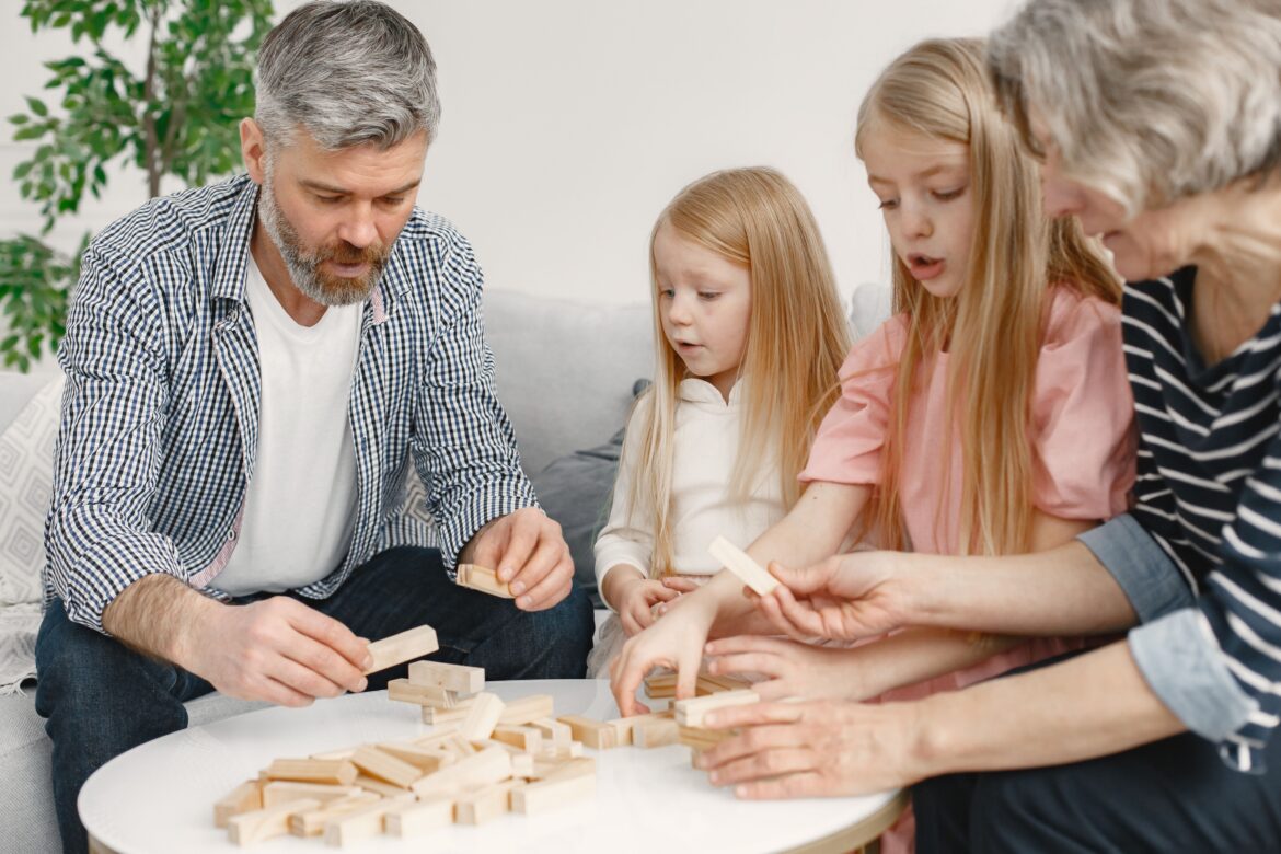 Family playing with toy blocks