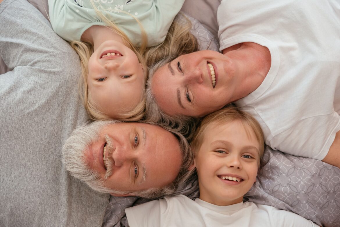 Grandparents and their grandchildren on the floor