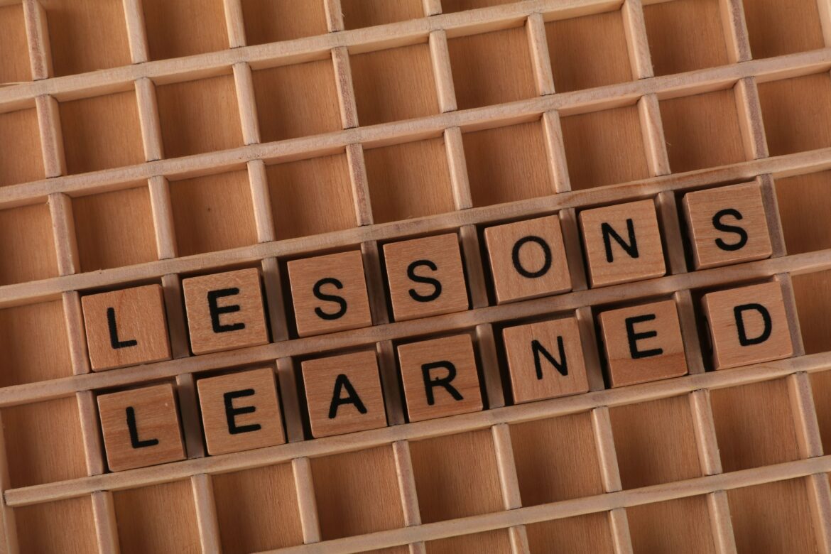 Lessons learned wooden letter blocks background