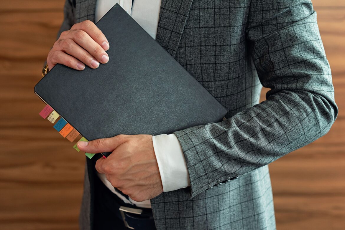 Man holding a notebook