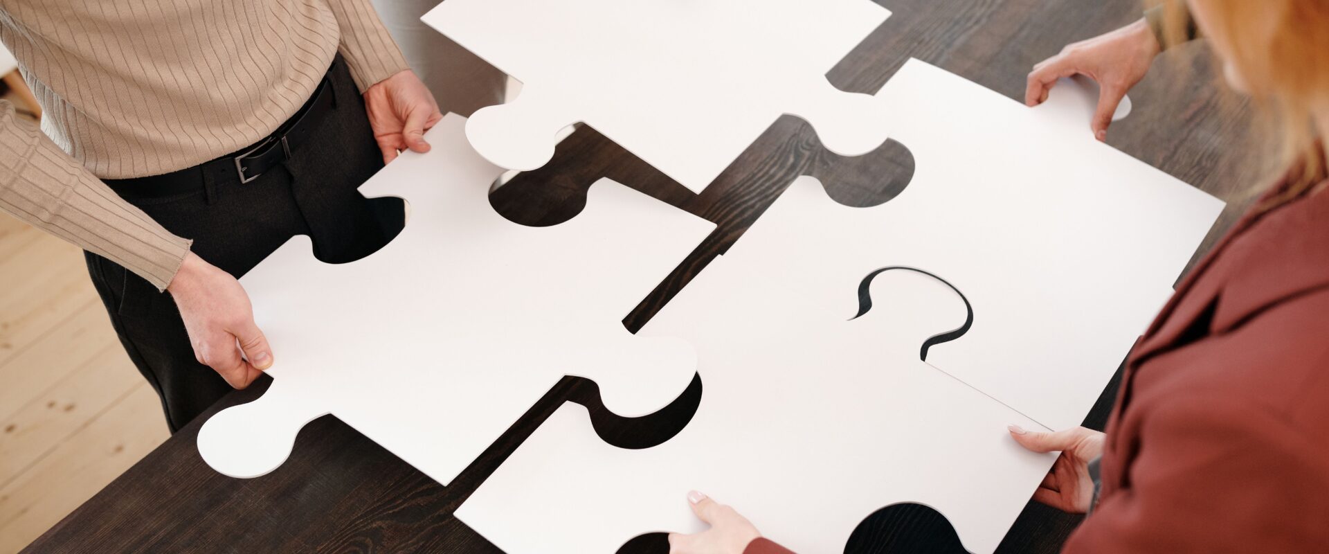 People holding puzzle pieces