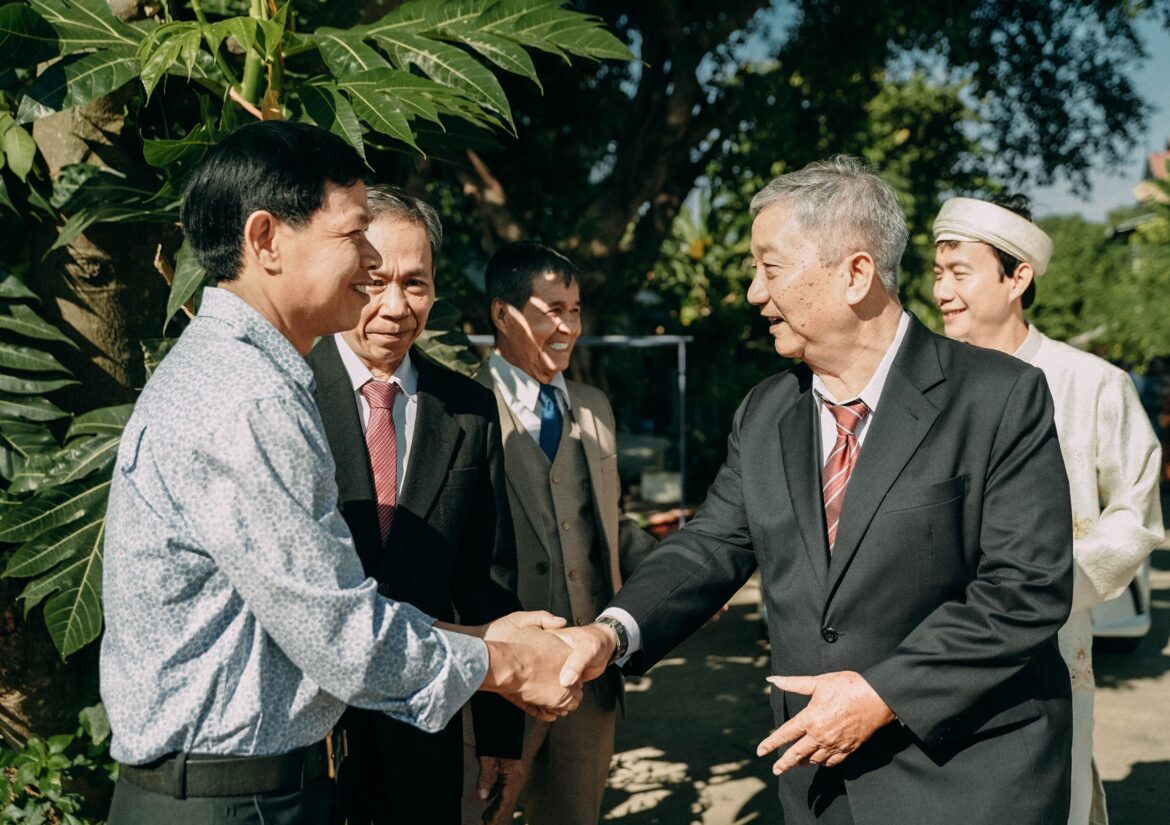 People in formal attire handshaking