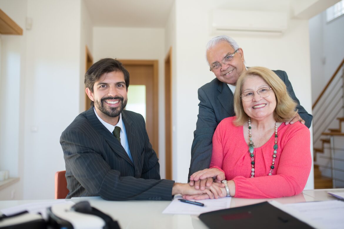Real estate agent and senior couple successful deal agreement